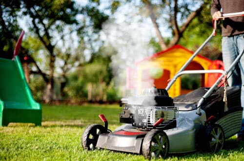 Why is my lawn mower blowing white smoke?